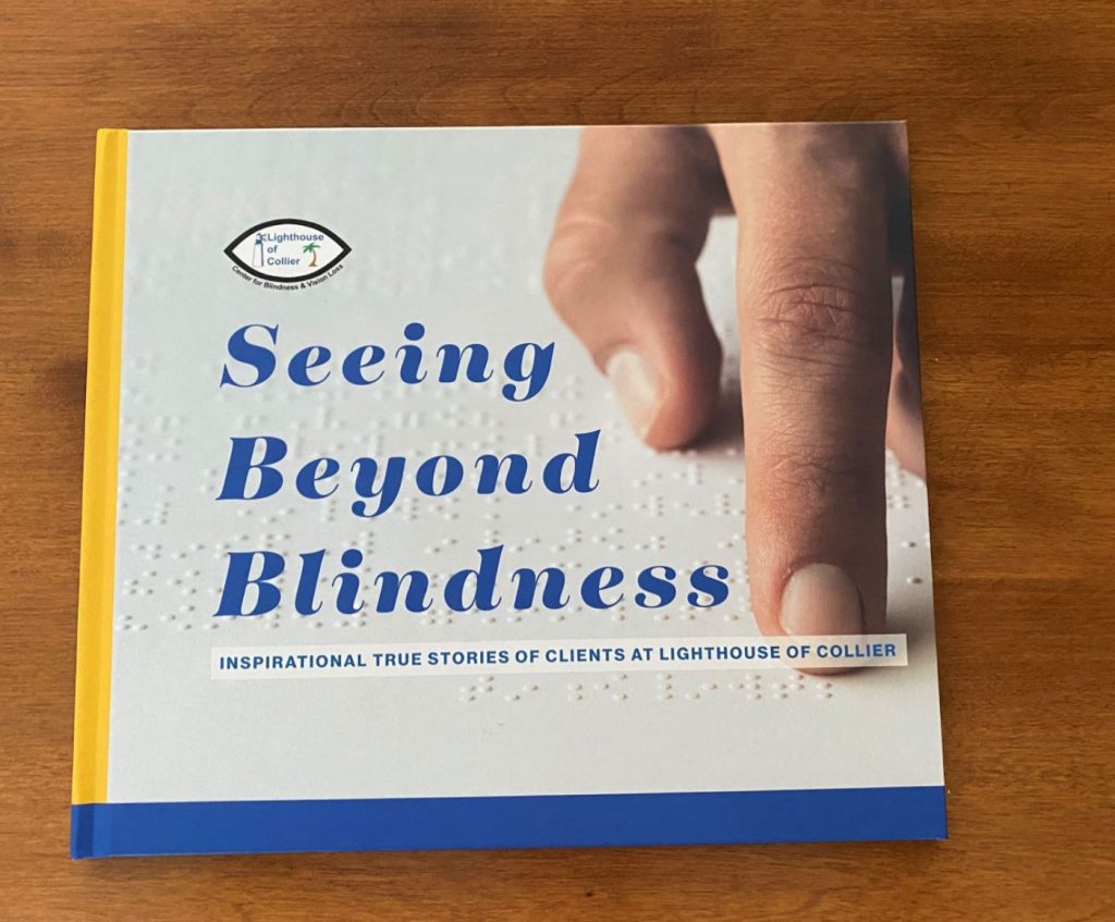 Seeing Beyond Blindness Coffee Table Book on wood table