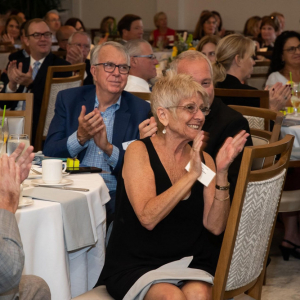People clapping at the Harvey Kapnick Award Ceremony