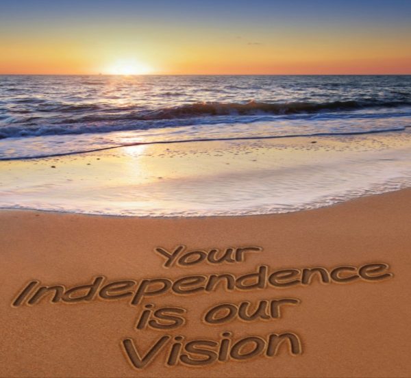 beach and sun set - sand says "Your Independence is our Vision"