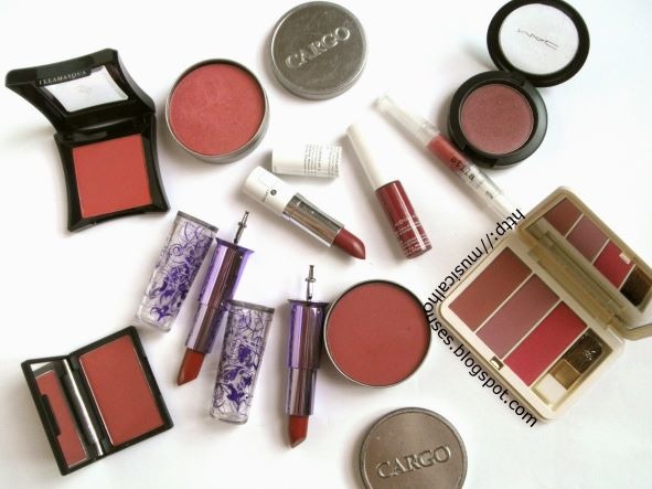 Assorted red and pink makeup products